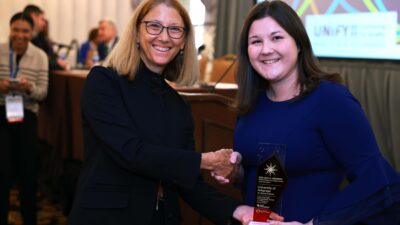 UAMS' Katelyn Faust (right) accepts the John M. Eisenberg Award from Dana Gelb Safran, president and CEO of the National Quality Forum and chief scientific officer of the Joint Commission.
