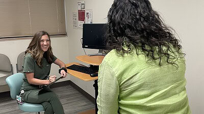 Samantha Crouch (left), director of the UAMS College of Nursing’s Nurse-Midwifery Program, is shown at the nurse-midwifery clinic at the Northwest Regional Campus in Fayetteville.