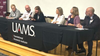 Heather Leidy, Ph.D. (center), addresses a question during a panel discussion at the Advancing Arkansas Lifespan Research Conference. Also pictured are, l-r: Laura James, M.D. (moderator), Brian Piccolo, Ph.D., Stacie Jones, M.D., Britni Ayers, Ph.D., and Colin Kay, Ph.D. (moderator).