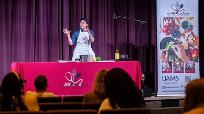 Alyssa Frisby, M.S., RD, LD, discusses the connection between foods and a person’s emotional health at the UAMS Women's Mental Health Forum on Oct. 2.