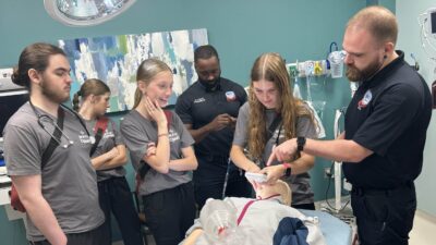 Students learn to intubate on a manikin at the 2025 MASH camp in Cabot.