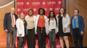 Jon and Donna Wolfe with scholarship recipients 2024