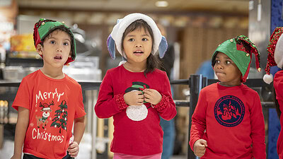 Head Start students sing for UAMS employees and guests in 2024.