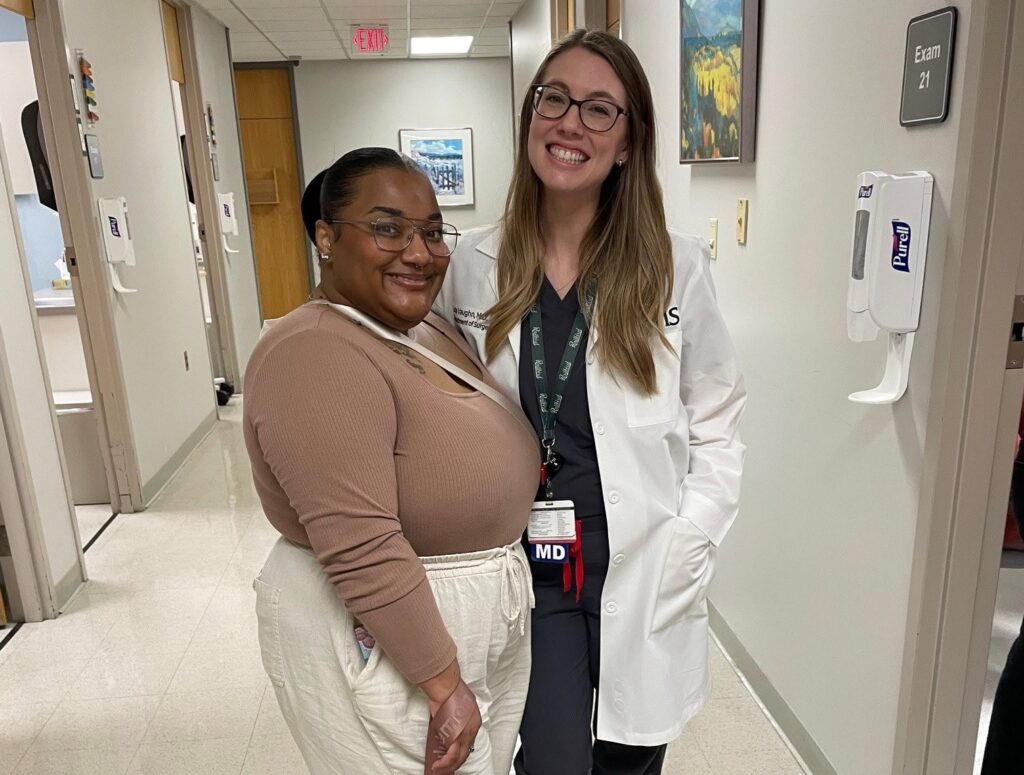 Jazmin Johnson, patient, and her doctor, surgeon Lexie Vaughn, pose for a picture together in a hallway at UAMS.