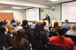 Chancellor C. Lowry Barnes speaks to several rows of employees at the South Central Regional Campus