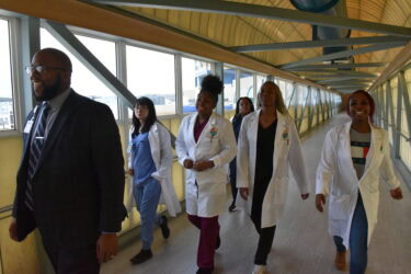 Nicholas Pettus (left) encouraged the students to remain in contact with one another during the next stages of their lives, noting that all of them have the ability to become leaders in the health care field.