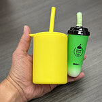 Photo of a hand holding vaping devices shaped like boba tea cups and sippy cups