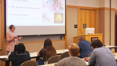Maegan Calvert, Ph.D., talks to community members about her research that uses neuroimaging to better understand human behavior, predict treatment outcomes, and develop interventions.