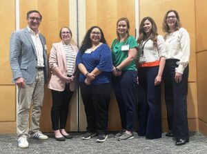 Led by UALR professor Julien Mirivel, Ph.D. (far left), the spring 2026 TRIumph program speakers included (from left) Maegan Calvert, Ph.D.; Alexa Escapita, Ph.D.; Meghan Breckling, Pharm.D.; Carol Morris, Ph.D.; and Meagan Kingren, Ph.D.