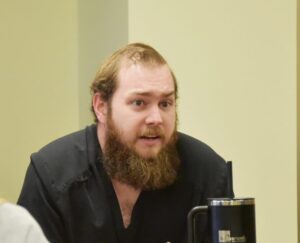 Resident Kirby Curtis, D.O., asks a question