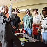 Tom South talks with undergraduate students about the College of Medicine