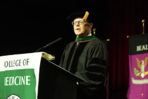 Robert Robertson, M.D., interim dean of the College of Medicine, offers advice to the class.