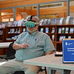 Doug Thompson, a reporter with the Northwest Arkansas Democrat Gazette, tries out a virtual reality headset that simulates the dementia experience.