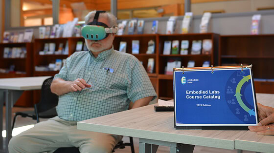 Doug Thompson, a reporter with the Northwest Arkansas Democrat Gazette, tries out a virtual reality headset that simulates the dementia experience.