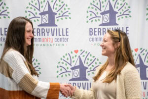 Hannah Dial with the UAMS Institute for Community Health Innovation and Christina Gillison, assistant director of the Berryville Community Center shake hands. 