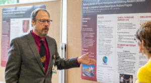 Bryan Clardy, M.D., from UAMS West points out the success of his 10-year study on sports physicials for underserved teens.