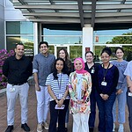 Abdel Fouda, Ph.D., right, and members of his laboratory, standing outside.