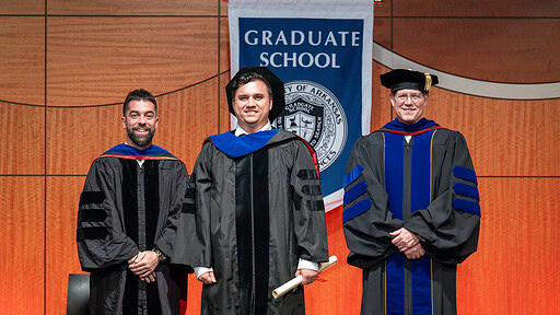 Aric Anloague, Jesus Delgado-Calle, Ph.D., and Graduate School Dean Sean Taverna, Ph.D.,