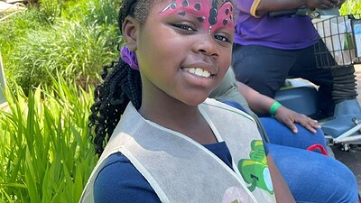 Melladee Joelle Thurman, 8, shows off her face paint at the NICU Reunion.