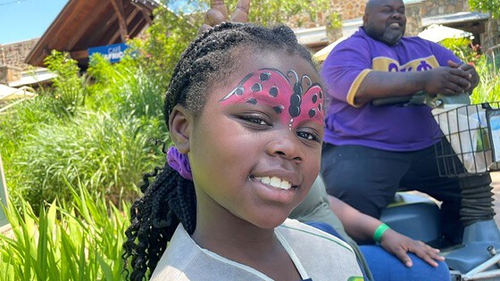 Melladee Joelle Thurman, 8, shows off her face paint at the NICU Reunion.