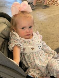 Wrenlee Burton from London, 3, a former NICU patient, tours the event in a stroller.