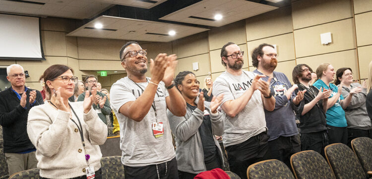 Families, friends and UAMS employees applaud the Project SEARCH graduates.