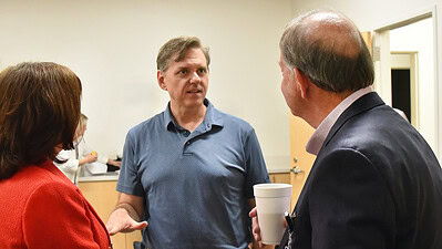 Timothy Abels, M.D., speaks to Dr. Barnes and Dr. Gardner