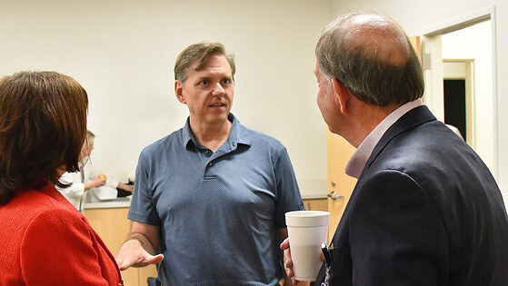 Timothy Abels, M.D., speaks to Dr. Barnes and Dr. Gardner