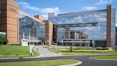 A picture of the exterior of the UAMS Medical Center and surrounding buildings.