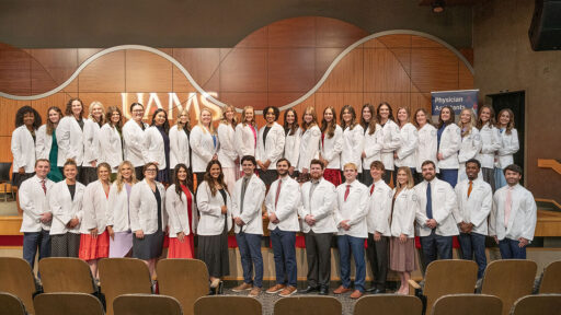 The PA Class of 2028 gather for a group photo following the white coat ceremony that officially inaugurates their course of study.