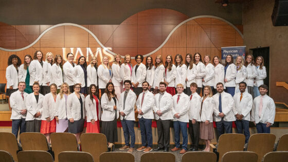 The PA Class of 2028 gather for a group photo following the white coat ceremony that officially inaugurates their course of study.