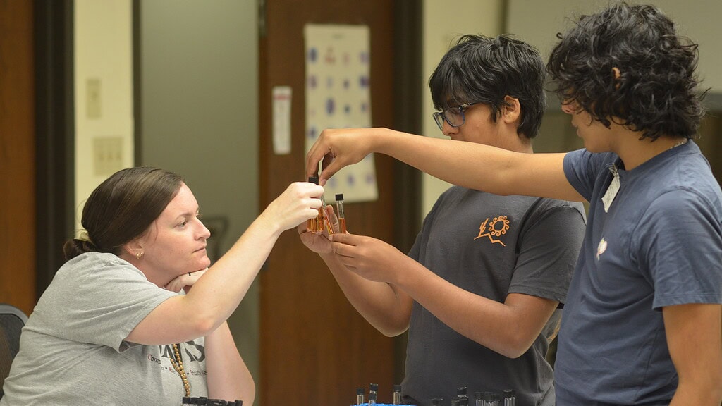 <p>Shelbie Stahr, Ph.D., MPH, (left) assistant professor in the UAMS Fay W. Boozman College of Public Health Department of Environmental Health Sciences, looks over water samples alongside two of the participants of the inaugural Summer Under the Microscope camp. </p>
<div><a class="more" href="https://news.uams.edu/dsc_0153-2/">Read more</a></div>