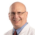 white-coat portrait of Paul Drew, Ph.D.