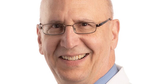 white-coat portrait of Paul Drew, Ph.D.
