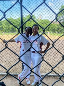 Team members pause for a picture on the field.