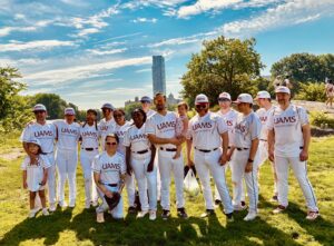 Members of the team all gathered for a photo in front of the NYC skyline.