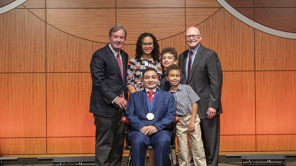 <p>C. Lowry Barnes, M.D.,  and Ron D. Robertson, M.D., joined Nadir Sharawi, M.D., (seated) and his family for a photograph.</p>
<div><a class="more" href="https://news.uams.edu/2026/06/03/uams-invests-nadir-sharawi-m-d-in-dola-thompson-m-d-professorship-in-anesthesiology/investiture-sharawi_nadir-md-05192026-edl_2161/">Read more</a></div>