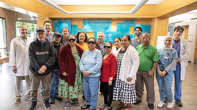 Jones Eye Institute doctors and Marshallese patients pose for a photo after the patients received cataract surgeries