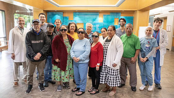 Jones Eye Institute doctors and Marshallese patients pose for a photo after the patients received cataract surgeries