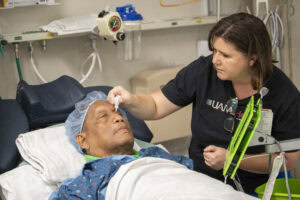 Anton Leviticus receives eyedrops from a UAMS provider while being prepped for surgery