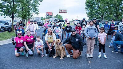 Staff from the UAMS Institute of Community Health Innovation poses with students and community members at the Walk and Roll to School event in May 2026.