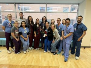 Staff from the NICU attended the ceremony to honor Sara Peeples, M.D. (center).