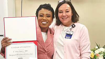 C'Asia James holds diploma with Donya Watson, M.D.