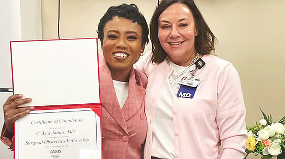 C'Asia James holds diploma with Donya Watson, M.D.