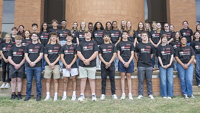 A group of high school students poses for a photo commemorating the College of Pharmacy's 2026 summer camp