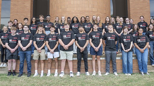 A group of high school students poses for a photo commemorating the College of Pharmacy's 2026 summer camp
