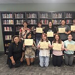 Students from Huntsville High School pose with their CHW training certificates