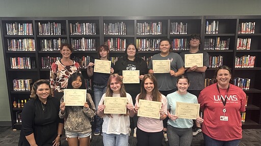 Students from Huntsville High School pose with their CHW training certificates