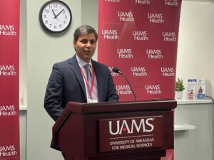 Rohit Dhall, M.D., chair of the UAMS Department of Neurology, announces the opening of a new clinic for MS and headache patients.