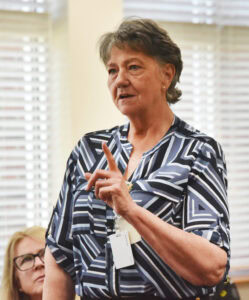 Female employee speaking and gesturing